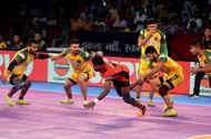 Vijay (r) attempts an ankle hold on Kashiling Adake